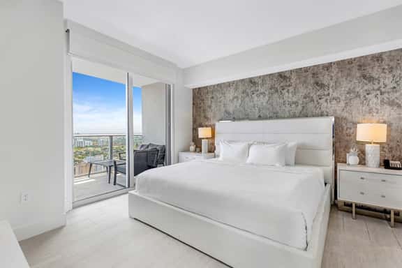 Step into the master bedroom featuring a king-size bed, an in-room bathroom, and direct access to a private balcony. This serene space combines comfort and style, perfect for unwinding while enjoying the views.